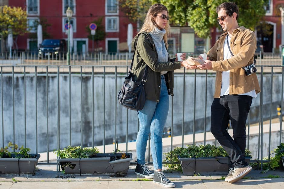Travelers sharing stories over coffee