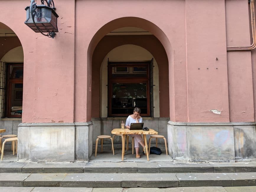 Digital nomad working from a scenic café